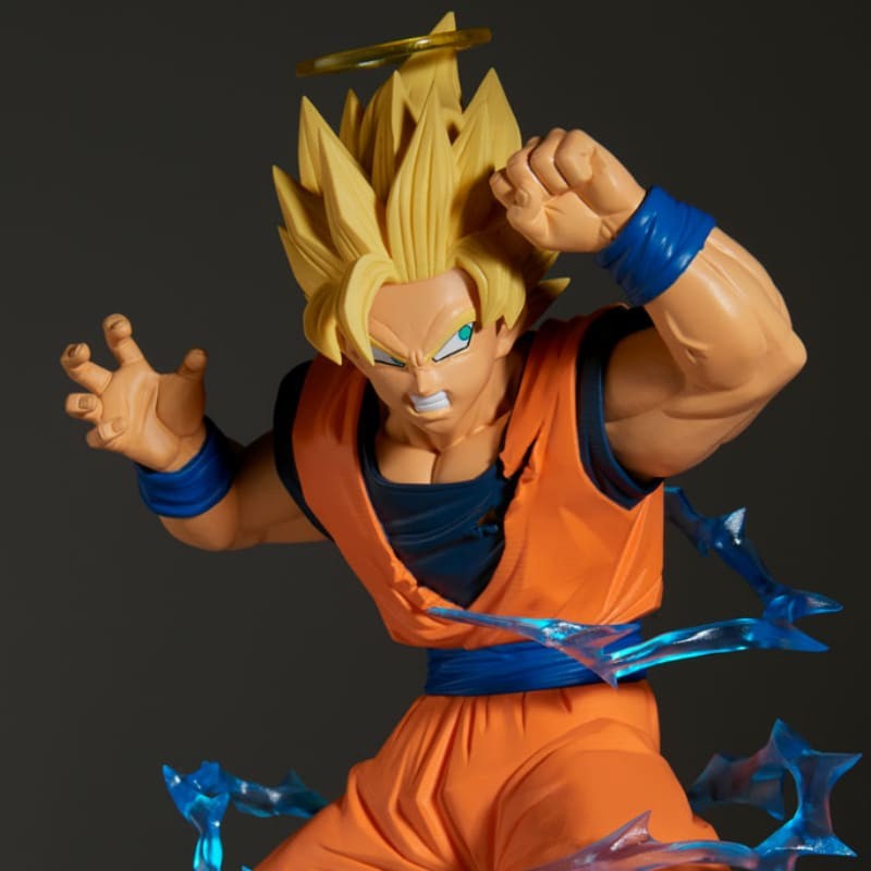 Cargue la imagen en el visor de la galería, Action figure in orange and blue outfit with spiky hair on a dark background
