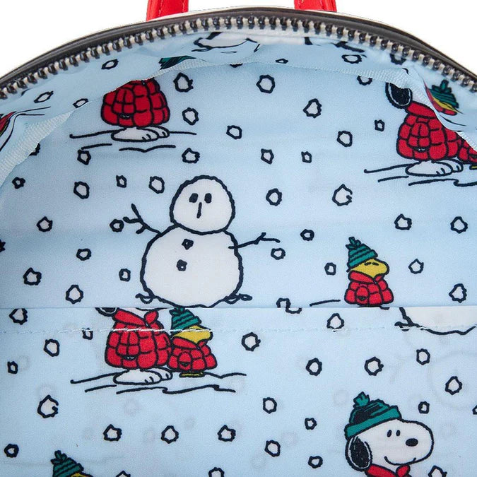 Chargez l'image dans la visionneuse de la galerie, Close-up of a backpack with winter-themed designs featuring cartoon characters and snowflakes.
