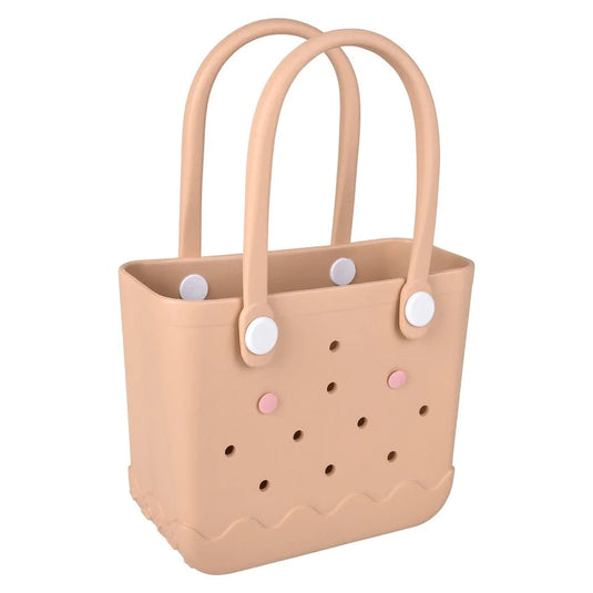 Beige basket with handles and decorative buttons on a white background